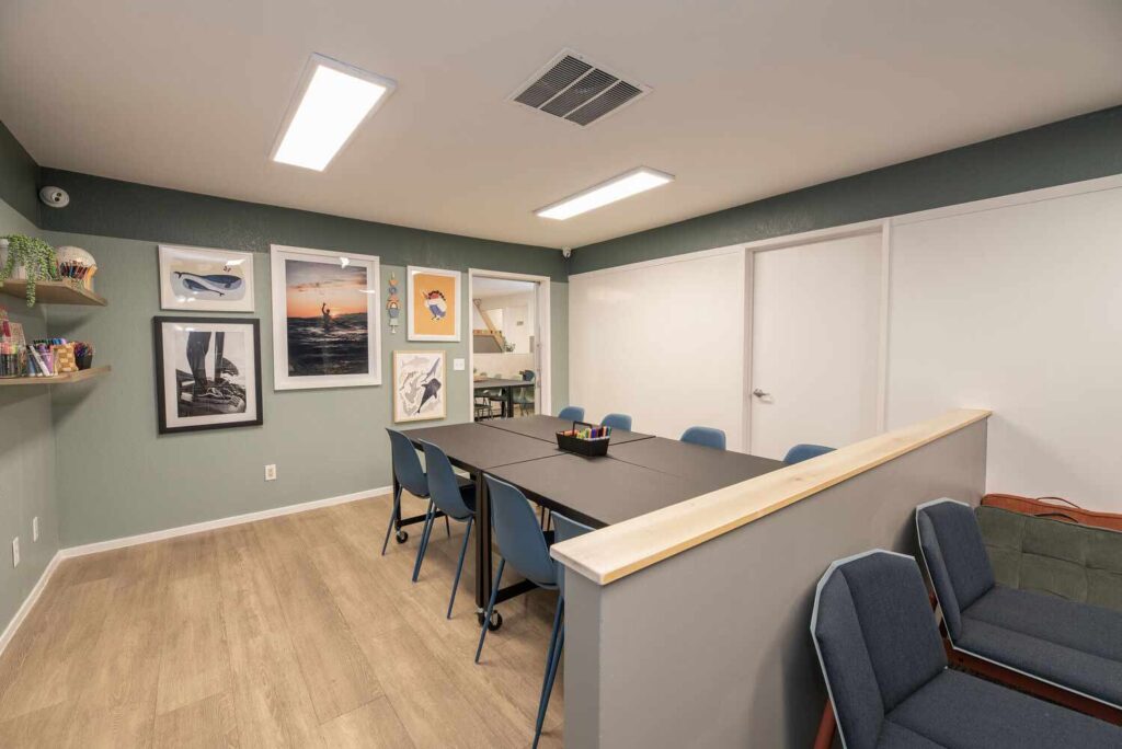 Kids club room with tables and coloring supplies