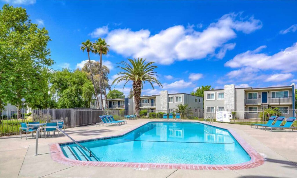 Pool and pool deck with tables and lounge chairs